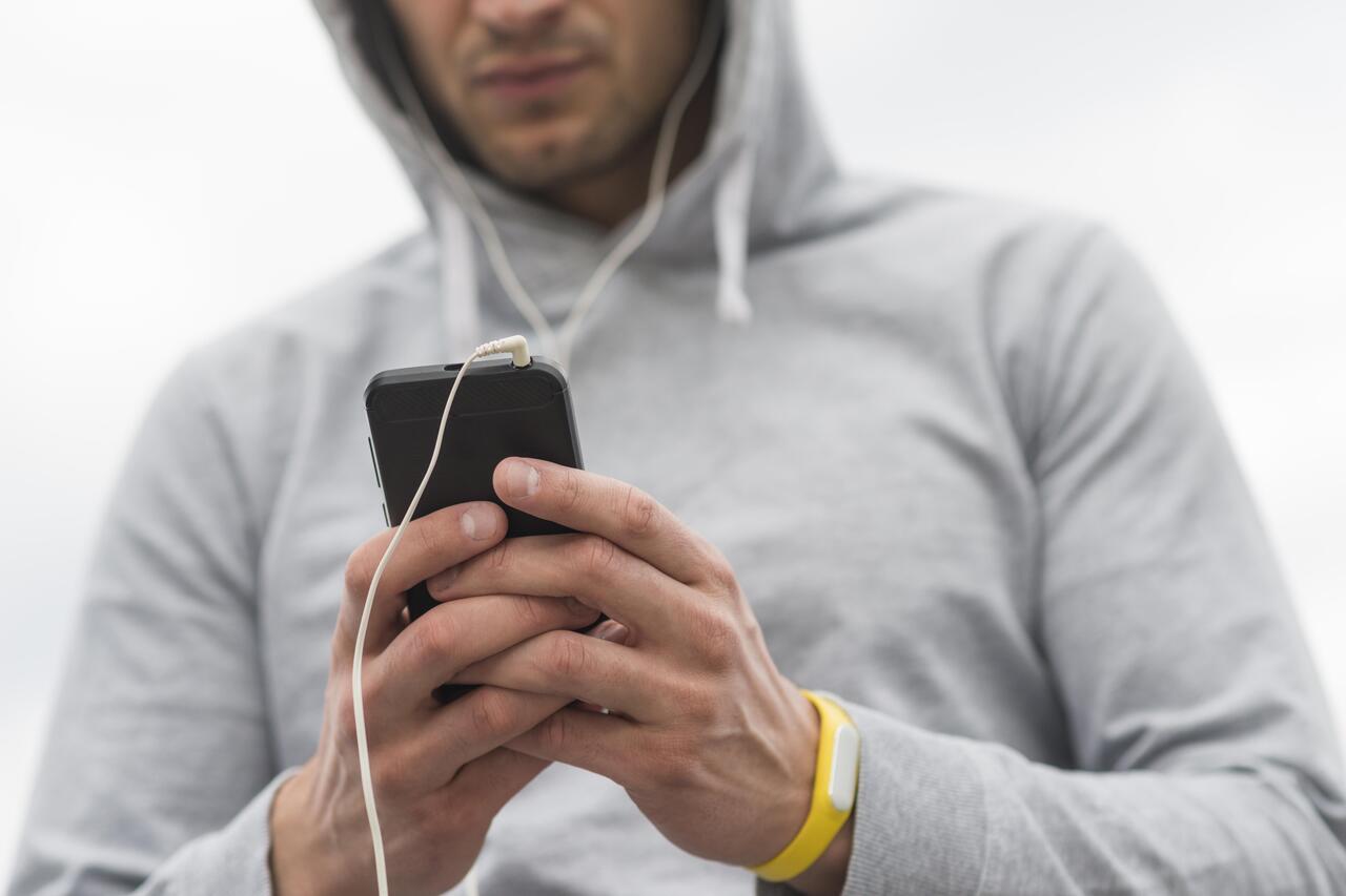 close-up-male-browsing-his-mobile-phone_1_1_1.jpg